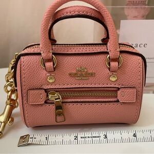 Pink mini Rowan keychain by Coach